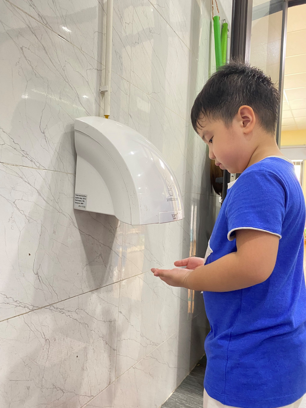 A picture containing person, child, young, toilet

Description automatically generated